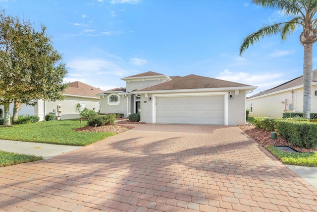 view of front of house with a front lawn and a garage