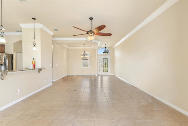 unfurnished living room with ceiling fan with notable chandelier, light tile patterned flooring, and crown molding