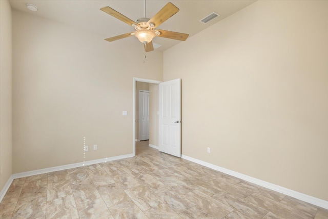 spare room featuring ceiling fan and high vaulted ceiling