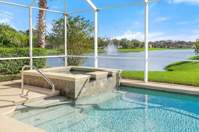 view of pool with glass enclosure and a water view