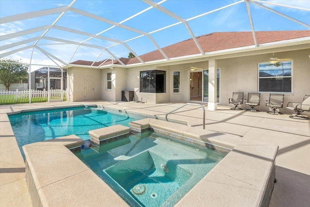 view of pool featuring an in ground hot tub, a patio area, ceiling fan, and a lanai