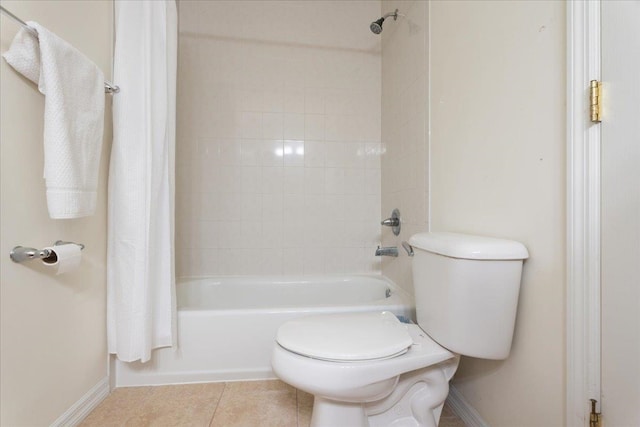 full bath featuring tile patterned flooring, shower / tub combo, and toilet