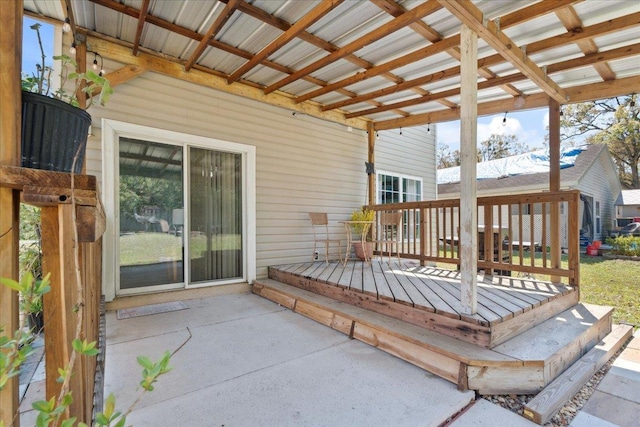 wooden deck with a patio area