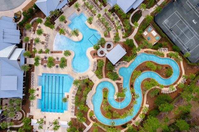 view of swimming pool with a water view, a gazebo, a water slide, and a patio