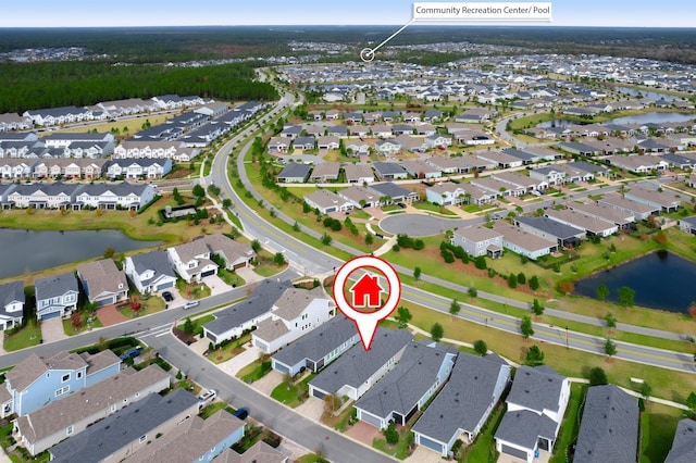 bird's eye view featuring a residential view and a water view