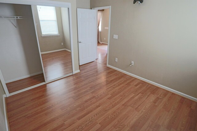 312 Brantley Harbor Dr, Saint Augustine, FL 32086 - unfurnished bedroom with baseboards, a closet, and light wood-type flooring