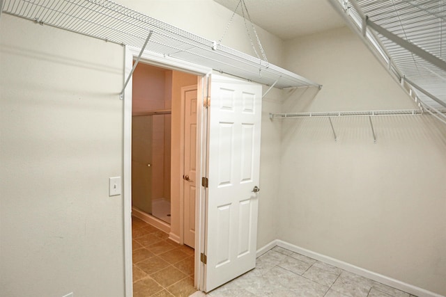 312 Brantley Harbor Dr, Saint Augustine, FL 32086 - spacious closet featuring light tile patterned flooring