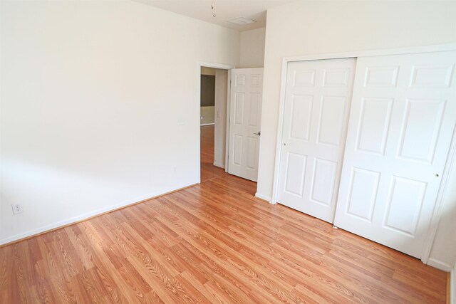 312 Brantley Harbor Dr, Saint Augustine, FL 32086 - unfurnished bedroom featuring light wood-style floors, baseboards, and a closet