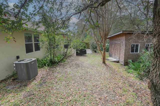 312 Brantley Harbor Dr, Saint Augustine, FL 32086 - view of yard featuring a storage shed, an outbuilding, and central AC unit