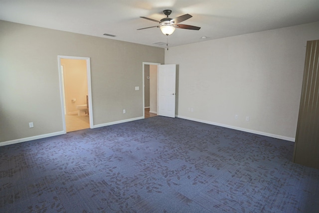 312 Brantley Harbor Dr, Saint Augustine, FL 32086 - unfurnished bedroom with connected bathroom, ceiling fan, dark colored carpet, baseboards, and visible vents