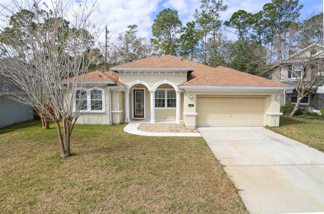 312 Brantley Harbor Dr, Saint Augustine, FL 32086 - mediterranean / spanish-style home with a front lawn, concrete driveway, an attached garage, a shingled roof, and stucco siding