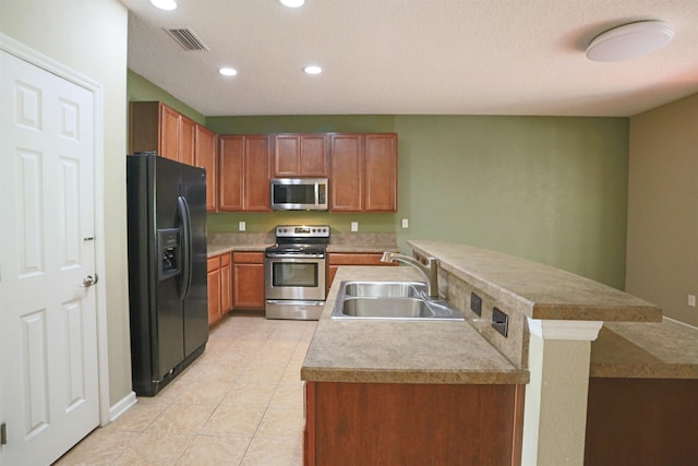 312 Brantley Harbor Dr, Saint Augustine, FL 32086 - kitchen featuring visible vents, appliances with stainless steel finishes, a sink, light tile patterned floors, and recessed lighting