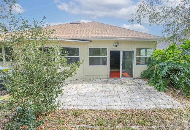 312 Brantley Harbor Dr, Saint Augustine, FL 32086 - rear view of house featuring a shingled roof and a patio area