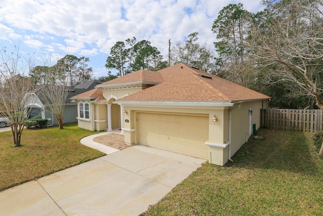 312 Brantley Harbor Dr, Saint Augustine, FL 32086 - mediterranean / spanish-style house with stucco siding, a front lawn, an attached garage, and fence