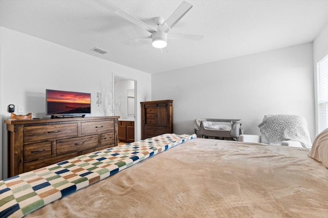 bedroom with connected bathroom and ceiling fan