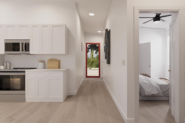 hall with light hardwood / wood-style flooring