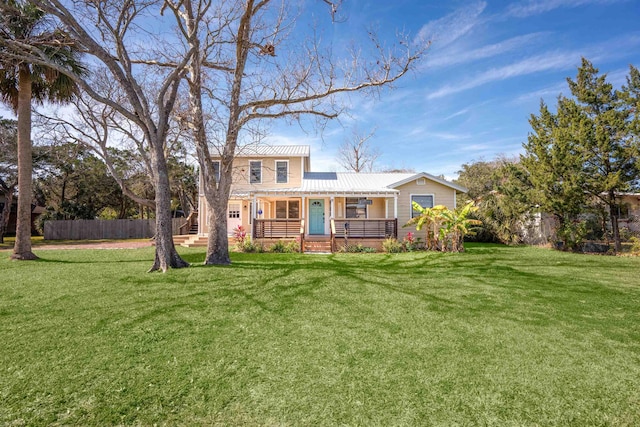 view of front facade with covered porch and a front yard