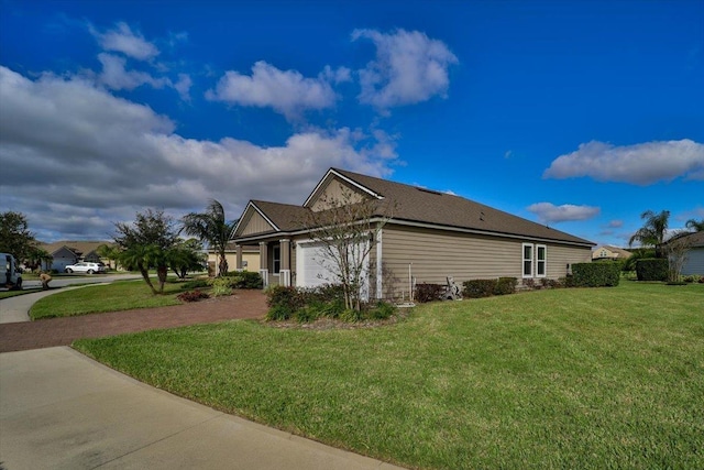 view of side of property featuring a yard and a garage