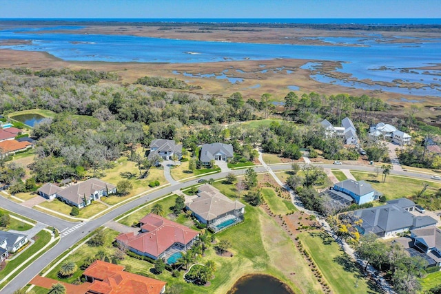 birds eye view of property featuring a residential view and a water view