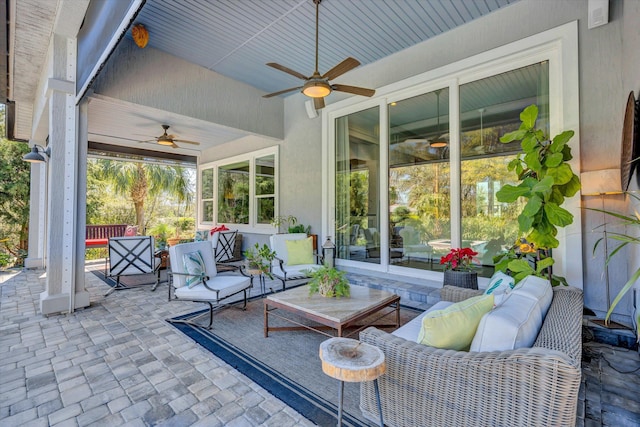 view of patio featuring an outdoor hangout area and ceiling fan