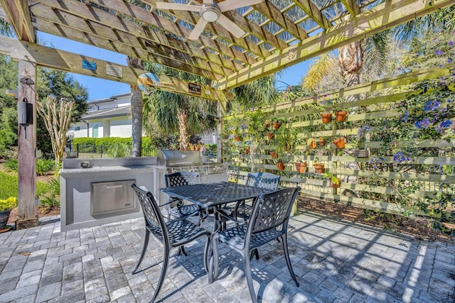 view of patio with outdoor dining space, a grill, a pergola, and area for grilling