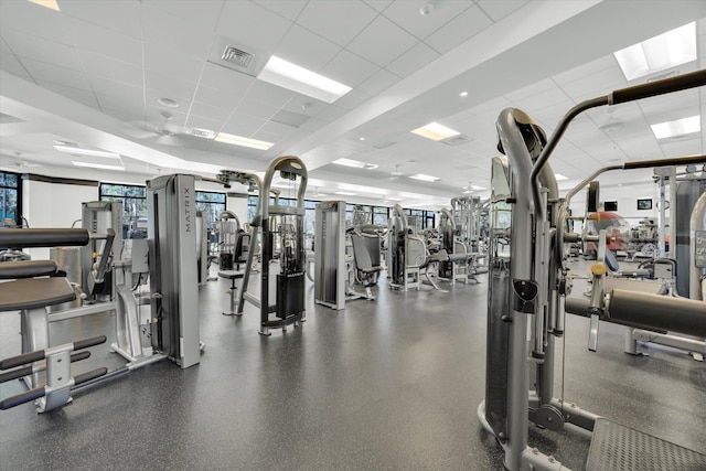 gym with visible vents and a paneled ceiling