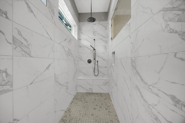 bathroom with tiled shower