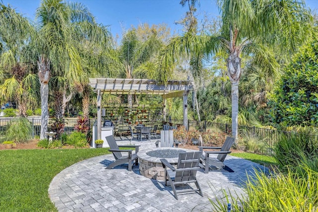 view of patio featuring fence, a pergola, and an outdoor fire pit