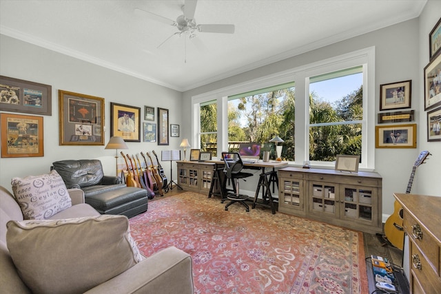 office featuring baseboards, crown molding, ceiling fan, and wood finished floors