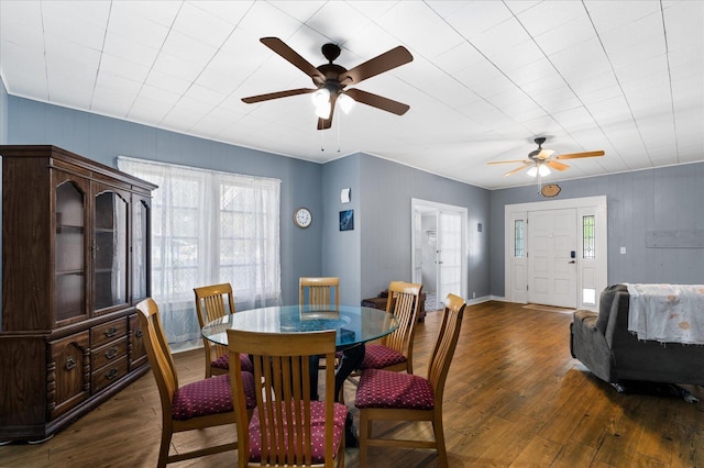 dining area featuring ceiling fan and dark wood-type flooring