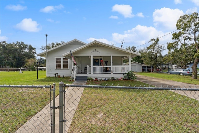 bungalow-style house with an outdoor structure and a front lawn