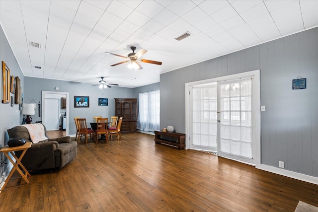 living room with hardwood / wood-style floors and ceiling fan