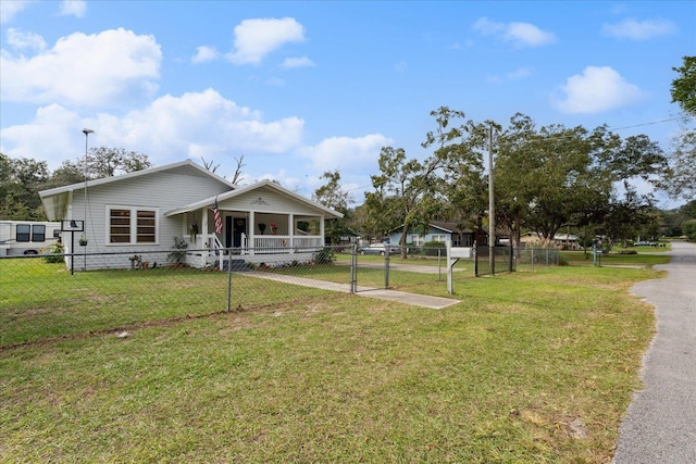 view of front of home with covered porch and a front yard