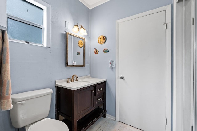 bathroom featuring toilet, vanity, and tile patterned floors