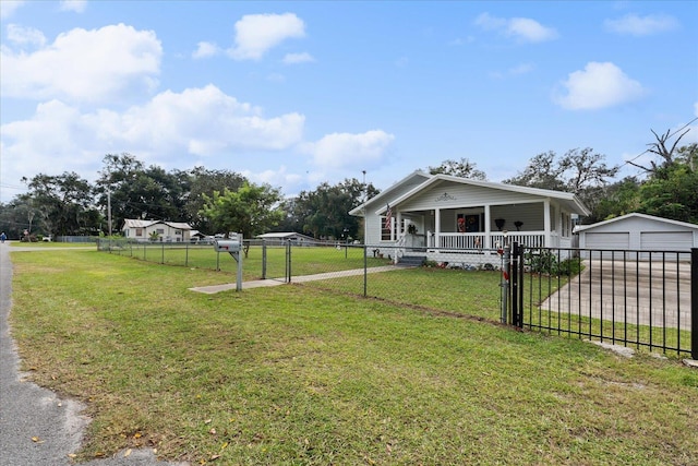 bungalow-style house featuring a garage, covered porch, an outbuilding, and a front lawn