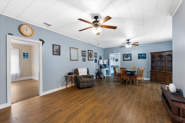 dining area with dark hardwood / wood-style floors and ceiling fan