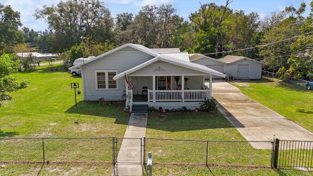 bungalow featuring covered porch and a front lawn