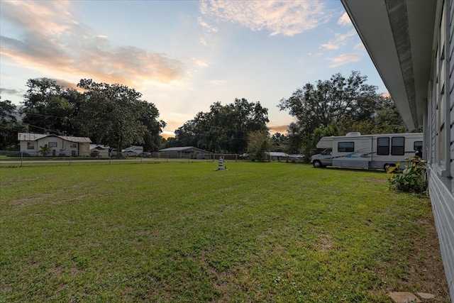 view of yard at dusk