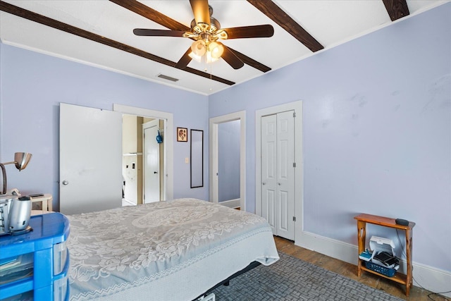 bedroom featuring dark hardwood / wood-style floors and ceiling fan