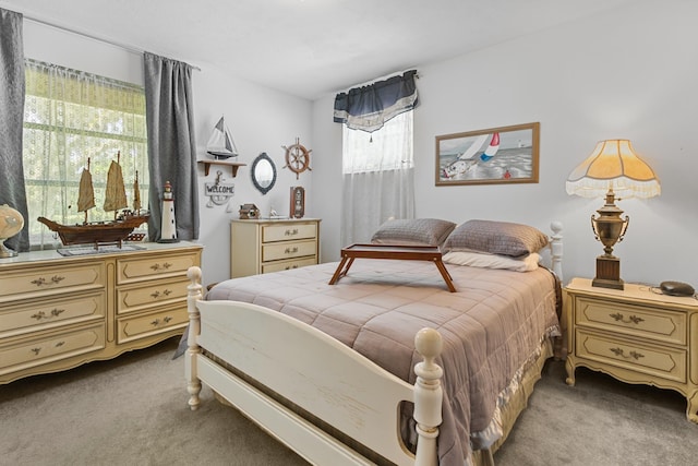 bedroom featuring light colored carpet