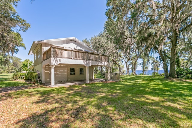 back of property featuring a yard, a deck, and a patio area