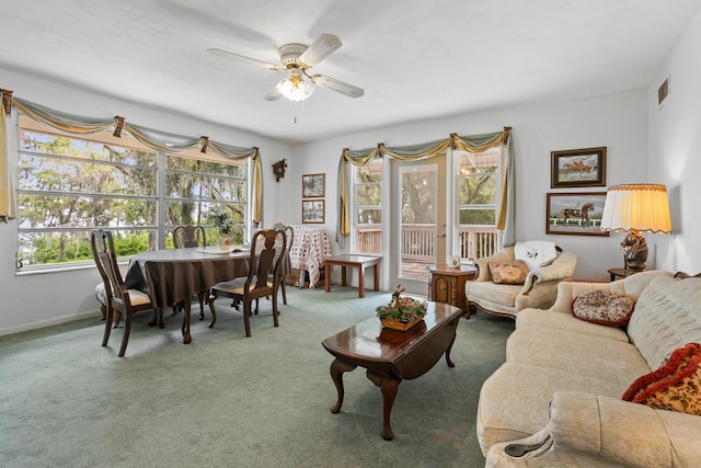 living room featuring carpet and ceiling fan