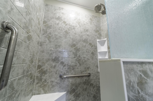 bathroom with tiled shower