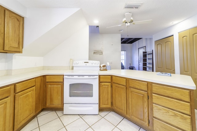 kitchen with electric range, ceiling fan, kitchen peninsula, a textured ceiling, and light tile patterned flooring