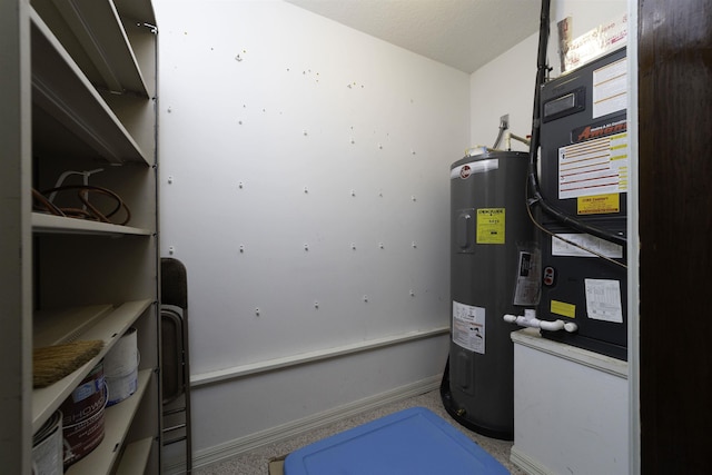 utility room featuring electric water heater