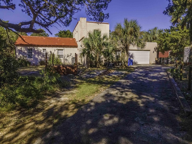 mediterranean / spanish-style house featuring a garage