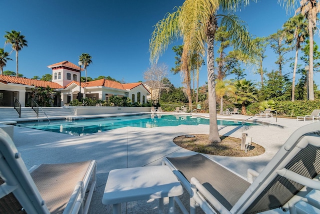 view of swimming pool featuring a patio