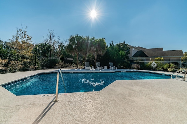 view of swimming pool featuring a patio