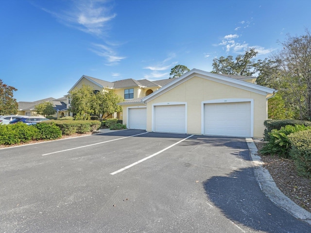 view of front of house featuring a garage and stucco siding