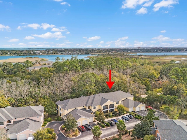 bird's eye view featuring a water view and a residential view